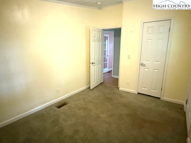 1269 Howell Road Lansing, NC 28643 - Photo 14 of 34 a view of an empty room