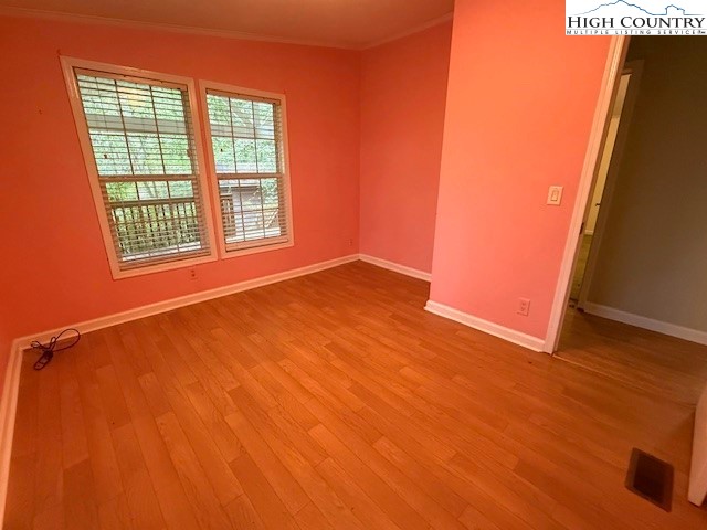 1269 Howell Road Lansing, NC 28643 - Photo 17 of 34 a view of an empty room with a window