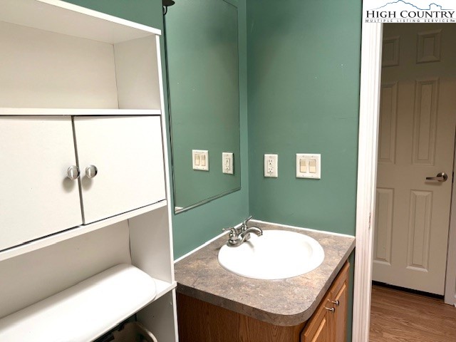 1269 Howell Road Lansing, NC 28643 - Photo 19 of 34 a bathroom with a sink and a mirror