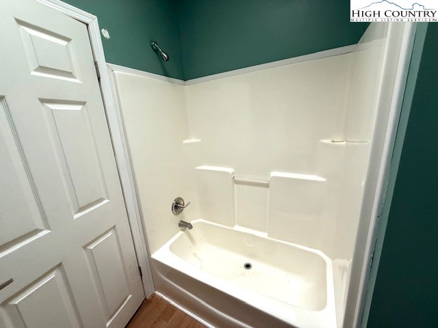 1269 Howell Road Lansing, NC 28643 - Photo 20 of 34 a bathroom with a tub and shower