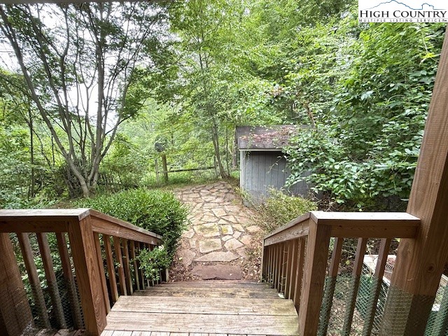 1269 Howell Road Lansing, NC 28643 - Photo 24 of 34 a balcony with wooden floor and yard in the back