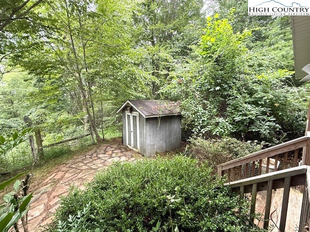 1269 Howell Road Lansing, NC 28643 - Photo 25 of 34 a backyard of a house with lots of green space