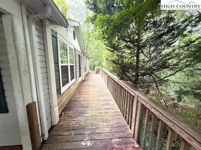 1269 Howell Road Lansing, NC 28643 - Photo 27 of 34 a view of a balcony with wooden floor and stairs