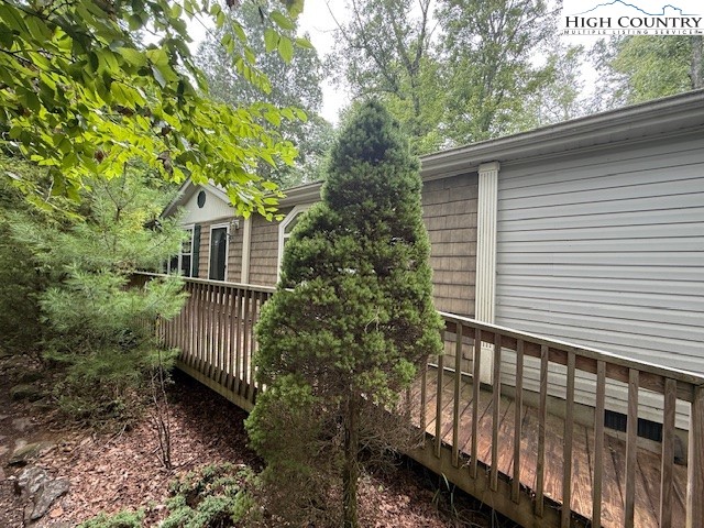 1269 Howell Road Lansing, NC 28643 - Photo 29 of 34 a view of a house with a yard and wooden fence