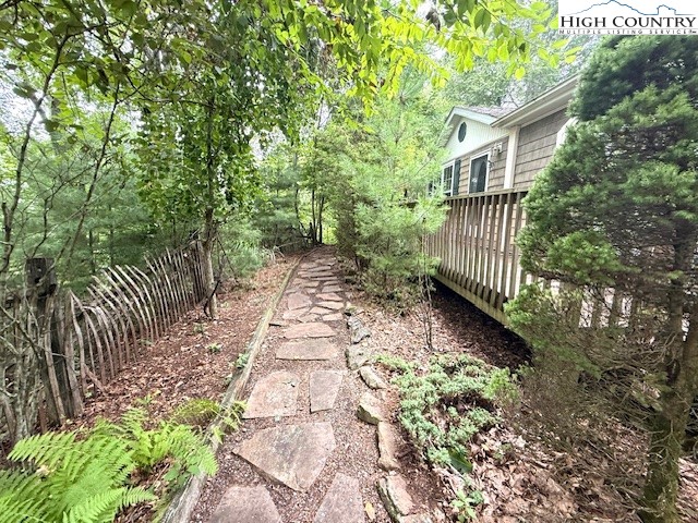 1269 Howell Road Lansing, NC 28643 - Photo 31 of 34 a backyard of a house with lots of green space