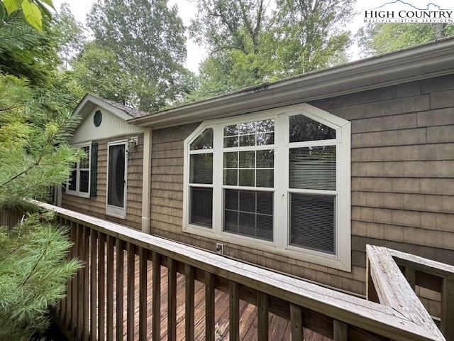 1269 Howell Road Lansing, NC 28643 - Photo 33 of 34 a view of a house with a large window and wooden fence