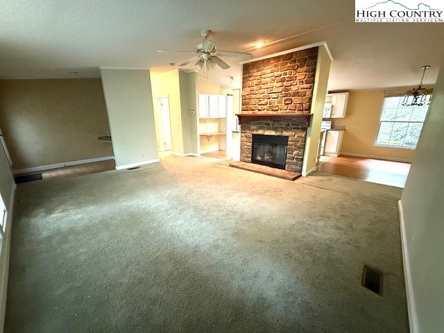 1269 Howell Road Lansing, NC 28643 - Photo 4 of 34 a view of empty room with fireplace and window