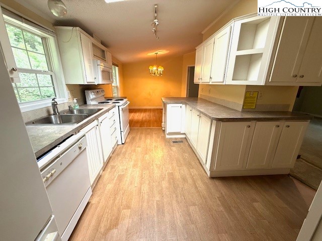1269 Howell Road Lansing, NC 28643 - Photo 6 of 34 a kitchen with counter top space and wooden floor
