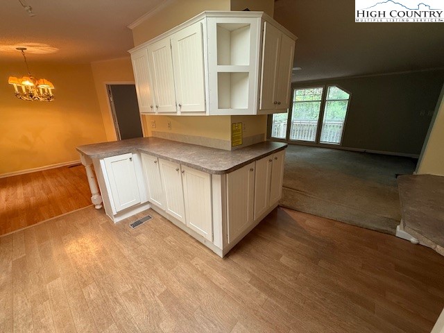 1269 Howell Road Lansing, NC 28643 - Photo 7 of 34 a kitchen with a stove and a white refrigerator