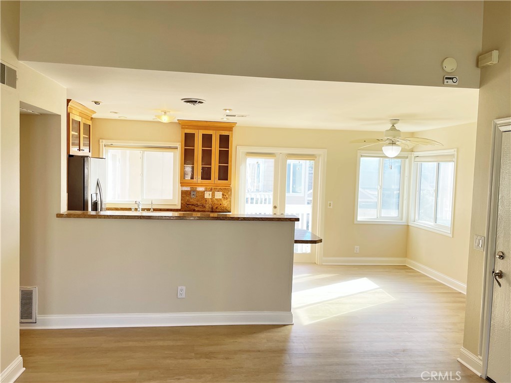 34006 Selva Road Dana Point, CA 92629 - Photo 4 of 16 a view of an empty room with wooden floor and a window