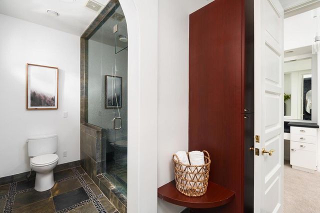 a view of a livingroom with furniture and a fireplace