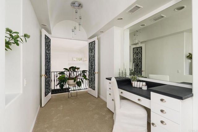 a kitchen with stainless steel appliances a refrigerator and cabinets