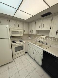 861 Maple Court, Unit 104 Dunedin, FL 34698 - Photo 6 of 14 a kitchen with cabinets stainless steel appliances and sink