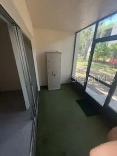 a view of an empty room and staircase