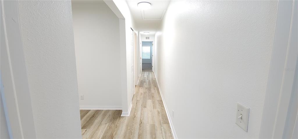259 Castlekeeper Place Valrico, FL 33594 - Photo 15 of 15 a view of a hallway with wooden floor
