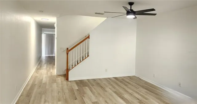 wooden floor in a hall with a window