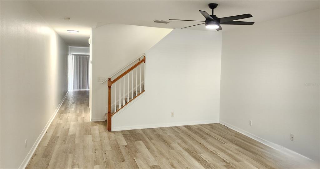 259 Castlekeeper Place Valrico, FL 33594 - Photo 2 of 15 wooden floor in a hall with a window