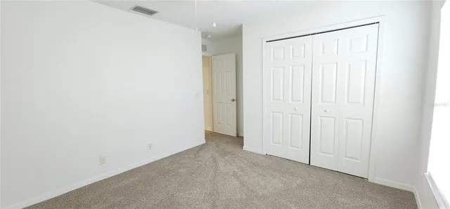 a view of a small space with wooden floor