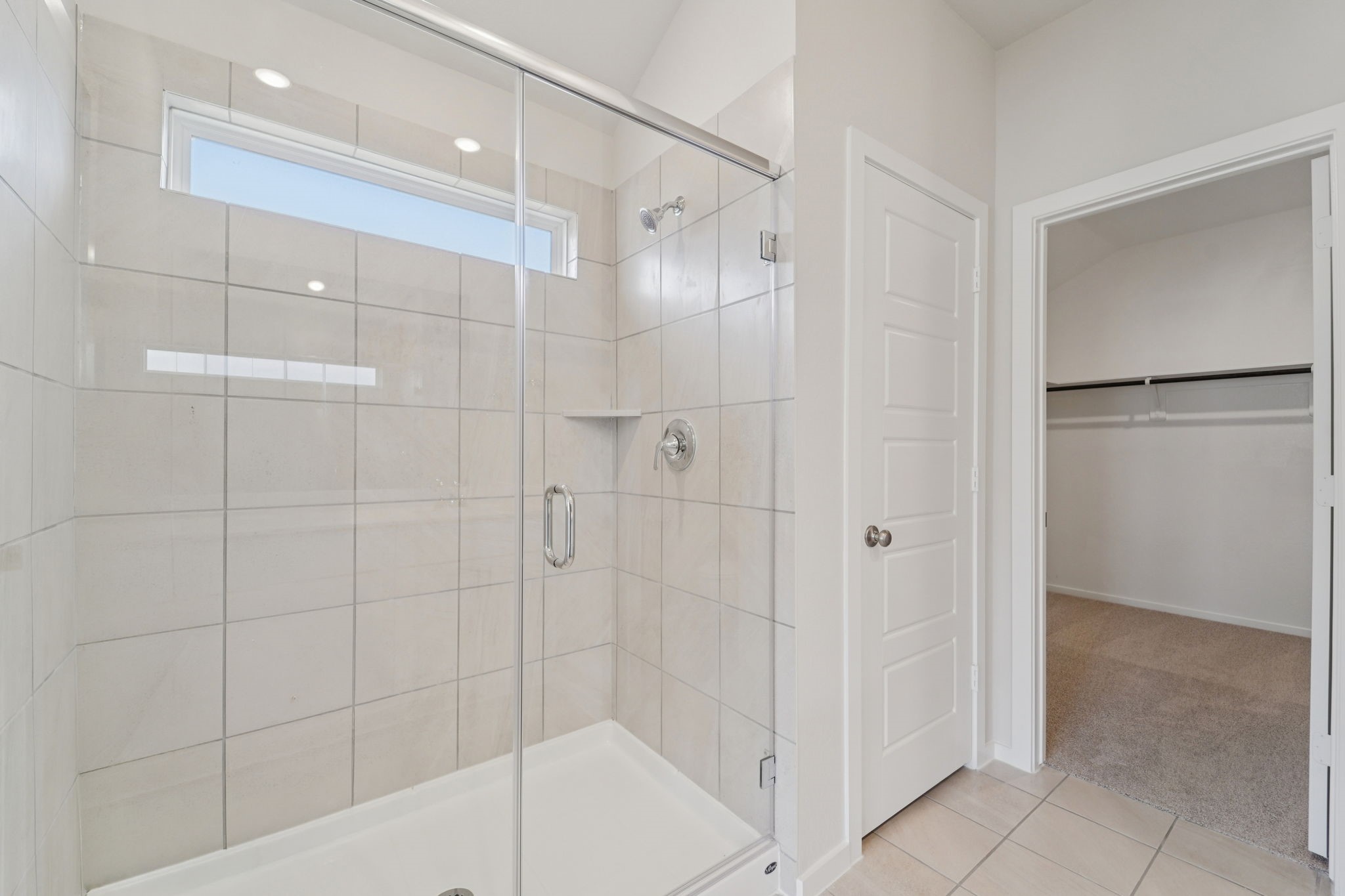 16253 Parish Pointe Court Conroe, TX 77302 - Photo 13 of 15 a bathroom with a shower and a glass door