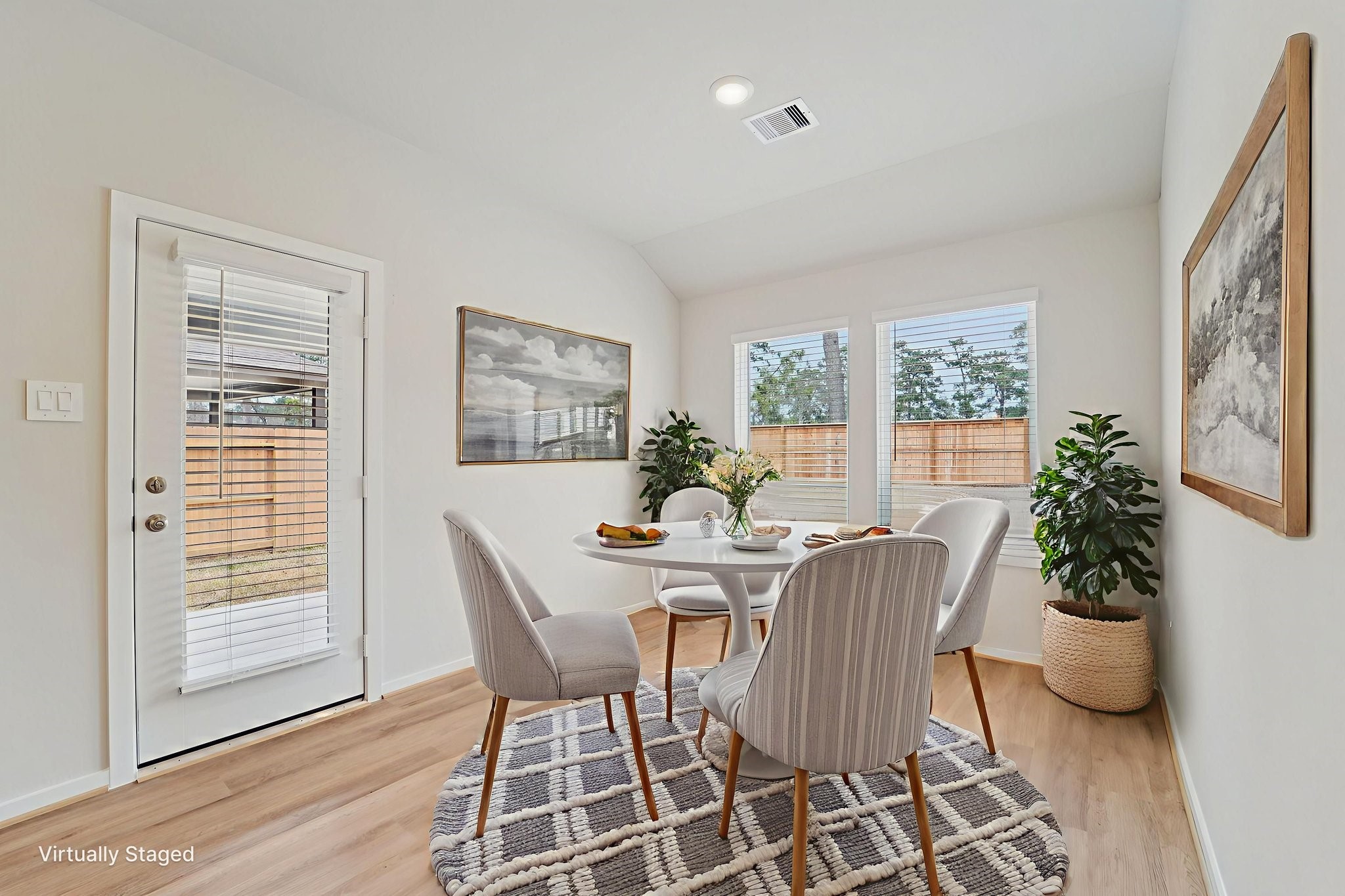 16253 Parish Pointe Court Conroe, TX 77302 - Photo 3 of 15 a view of a dining room with furniture and wooden floor
