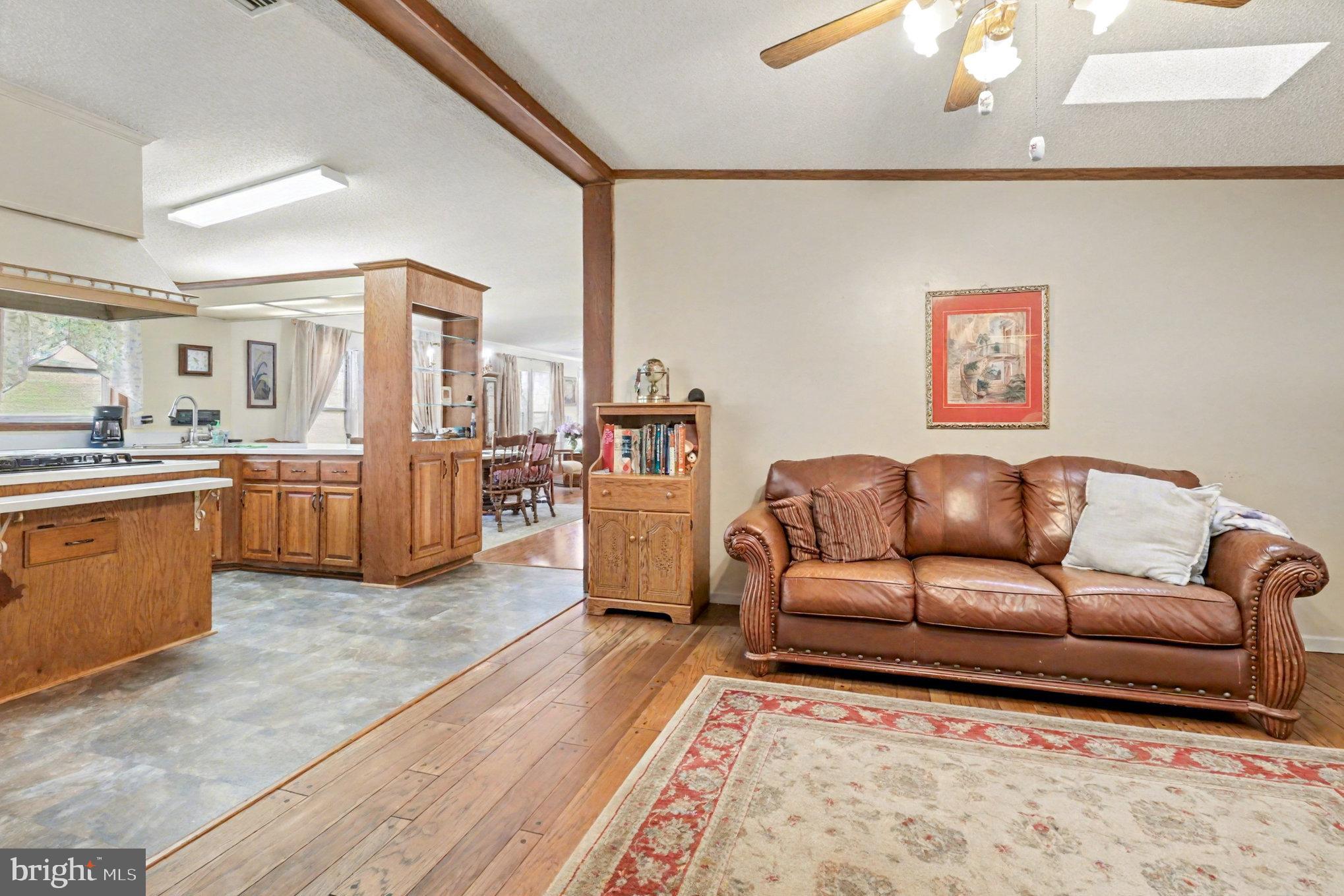 13092 State Road King George, VA 22485 - Photo 9 of 35 a living room with furniture and kitchen view