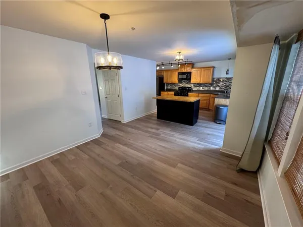 a view of a kitchen with a sink and dishwasher