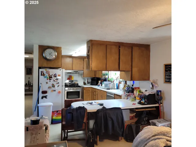a kitchen with a sink cabinets and window