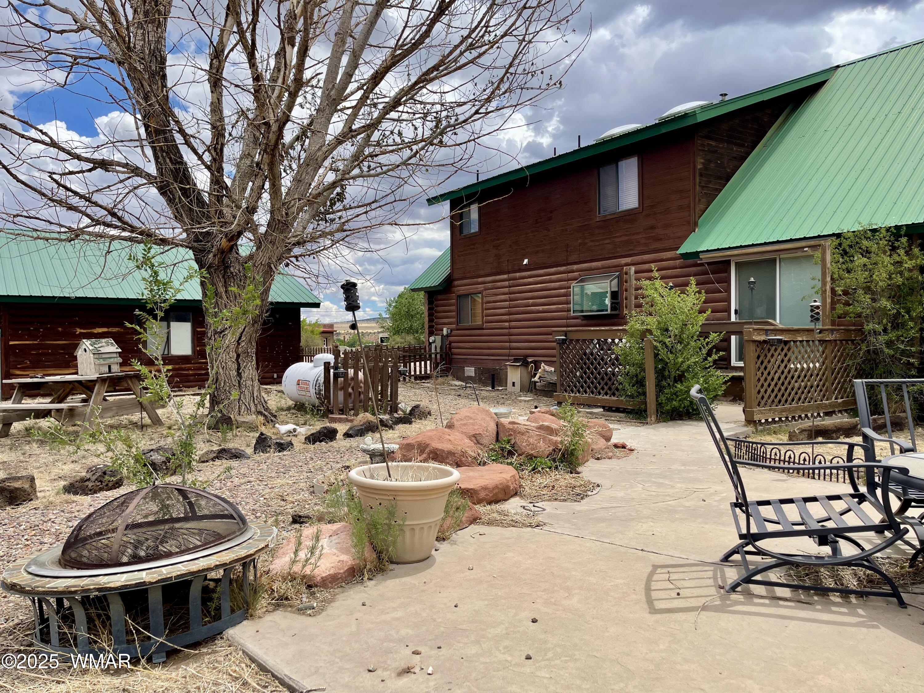183 North Becker Lake Road Springerville, AZ 85938 - Photo 34 of 41 a view of a patio with chair and tables