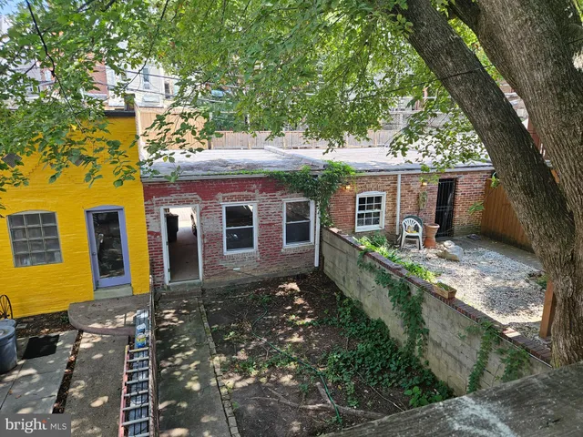 a brick house with a small yard