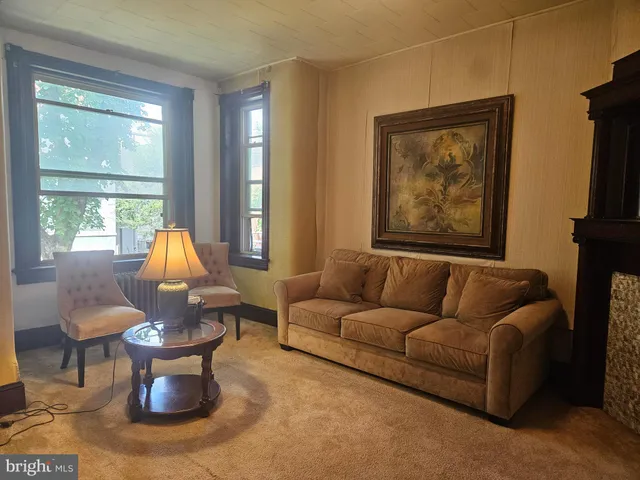 a living room with furniture or couch and a window