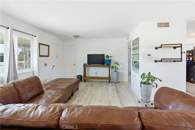 a living room with a couch and a flat screen tv