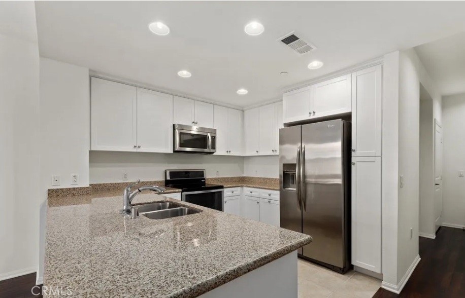 408 West Main Street Alhambra, CA 91801 - Photo 3 of 8 a kitchen with stainless steel appliances granite countertop a refrigerator a stove and a sink