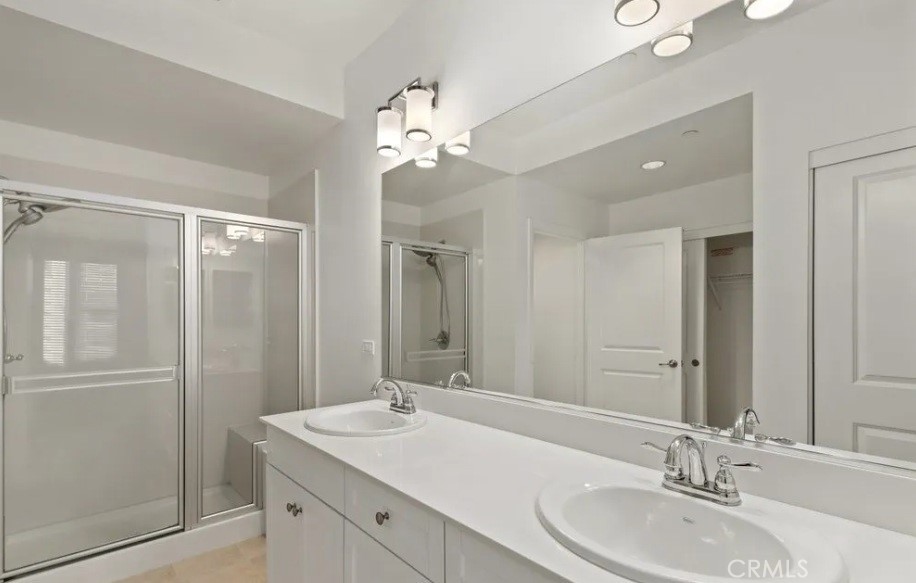 408 West Main Street Alhambra, CA 91801 - Photo 6 of 10 a bathroom with a double vanity sink and a mirror