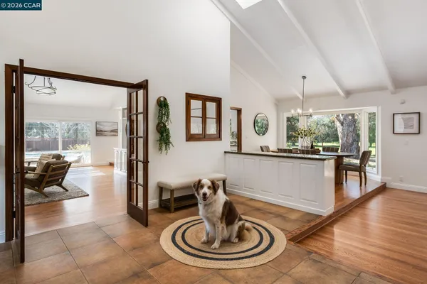 a living room with fireplace furniture and a wooden floor