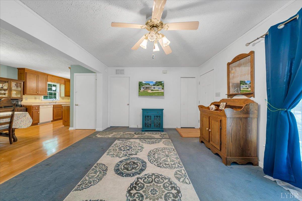 1124 Homeplace Road Bedford, VA 24523 - Photo 7 of 47 a bedroom with a bed and a chandelier