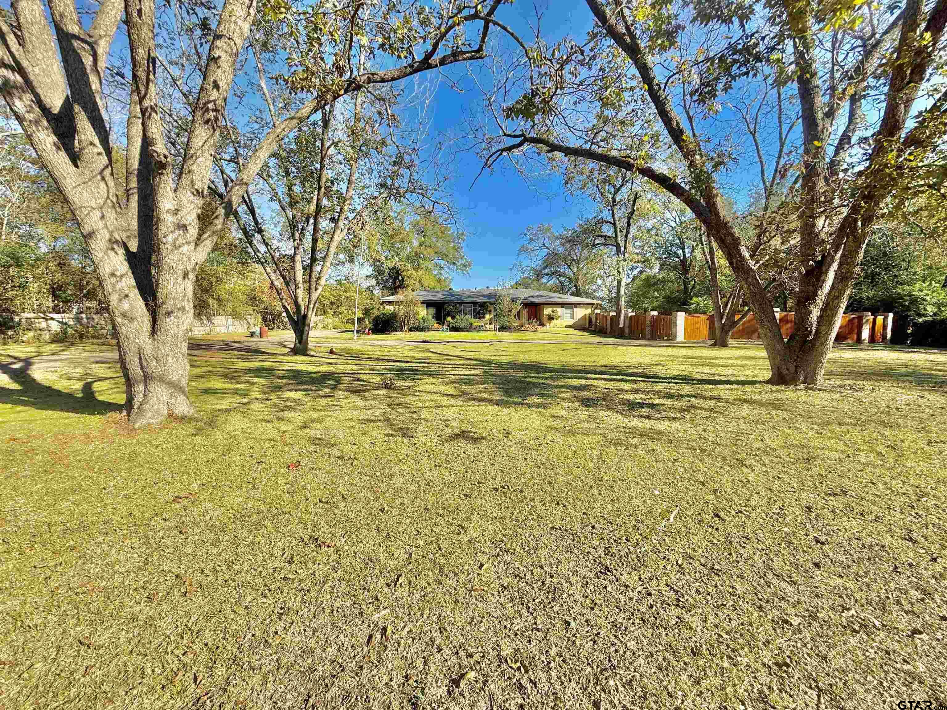 a view of yard with swimming pool