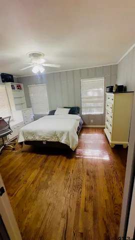 a bedroom with a bed and window