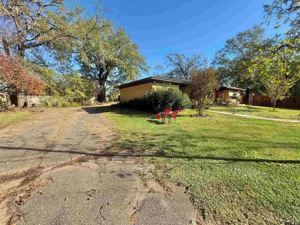 a view of a yard with an outdoor space