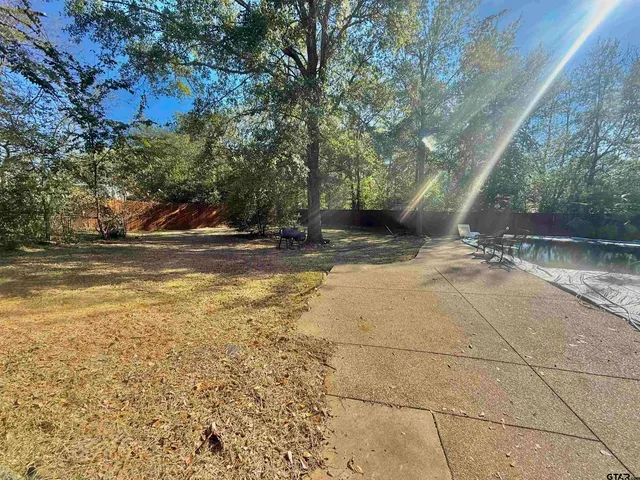 a view of a yard with an outdoor space