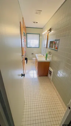 a bathroom with a bathtub and shower