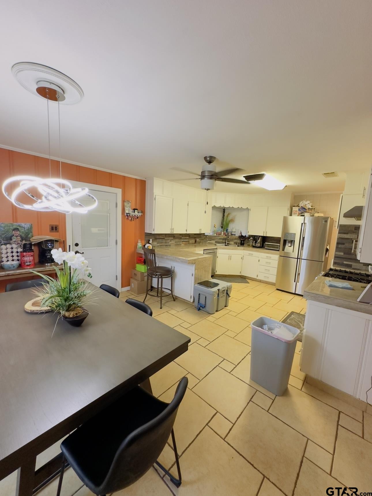 2008 Longview Drive Henderson, TX 75652 - Photo 4 of 18 a room with wooden cabinets and dining table