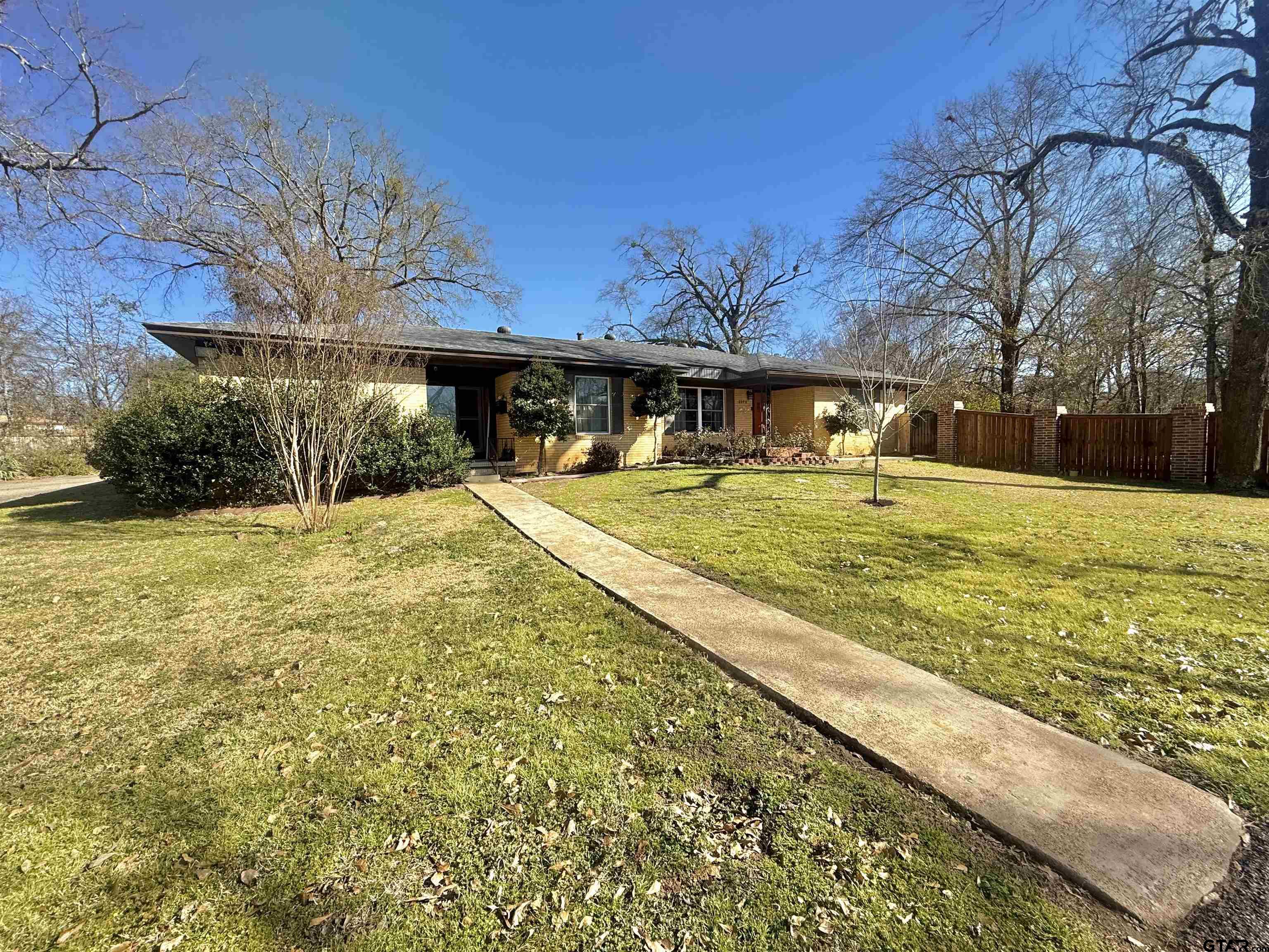 2008 Longview Drive Henderson, TX 75652 - Photo 10 of 27 a view of a house with a yard