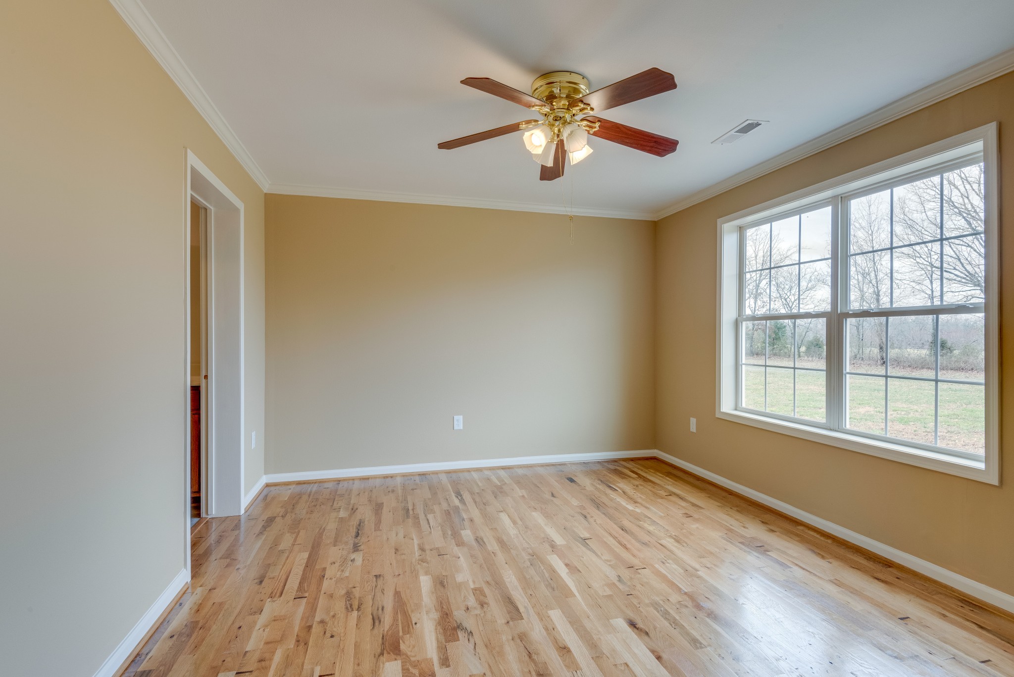 7349 Coldwater Road Fairview, TN 37062 - Photo 11 of 24 wooden floor in an empty room with a window