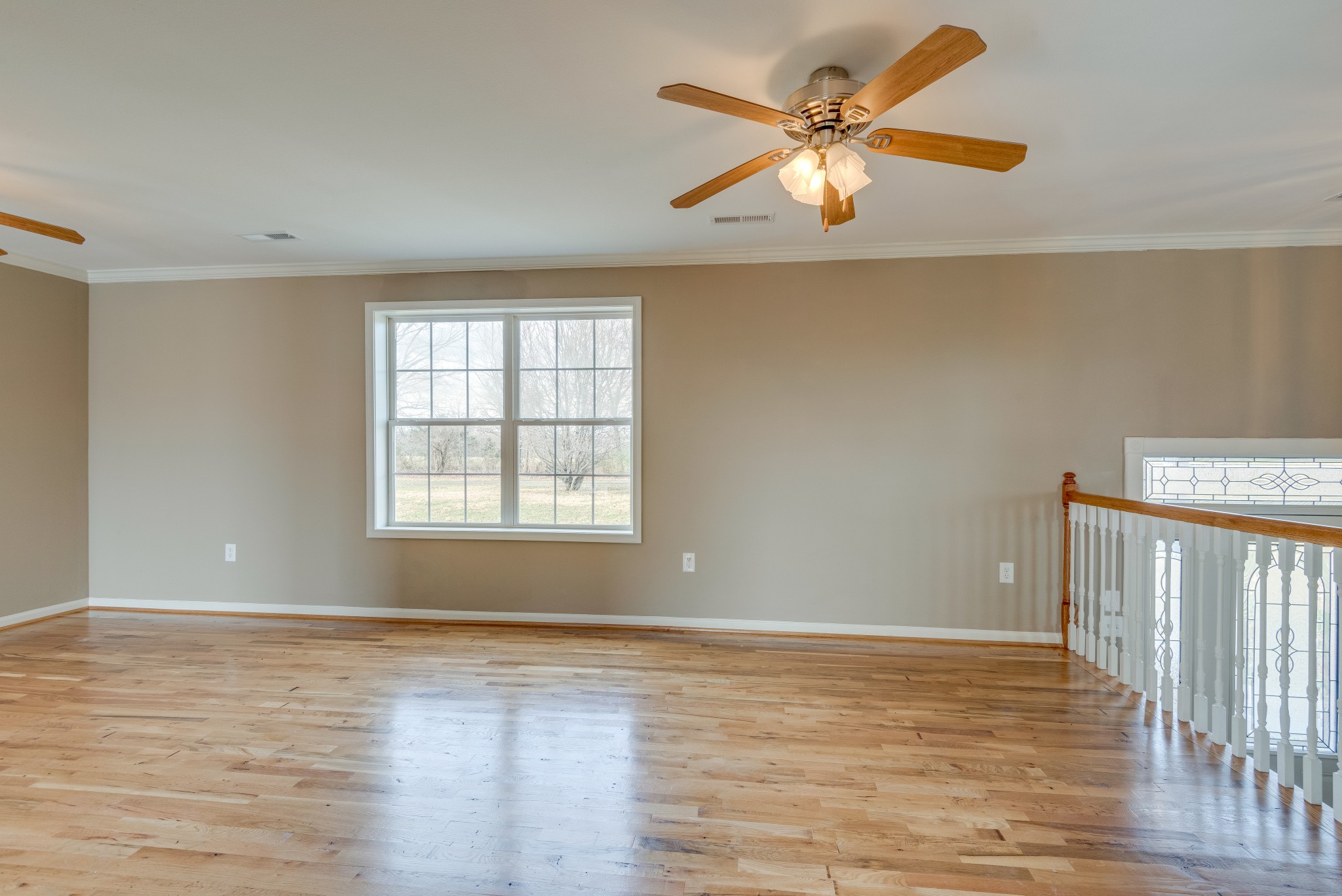 7349 Coldwater Road Fairview, TN 37062 - Photo 3 of 24 a view of an empty room with window and wooden floor