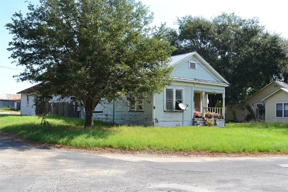 1053 Eilers Street Schulenburg, TX 78956 - Photo 3 of 5 a view of a house with a yard and large tree