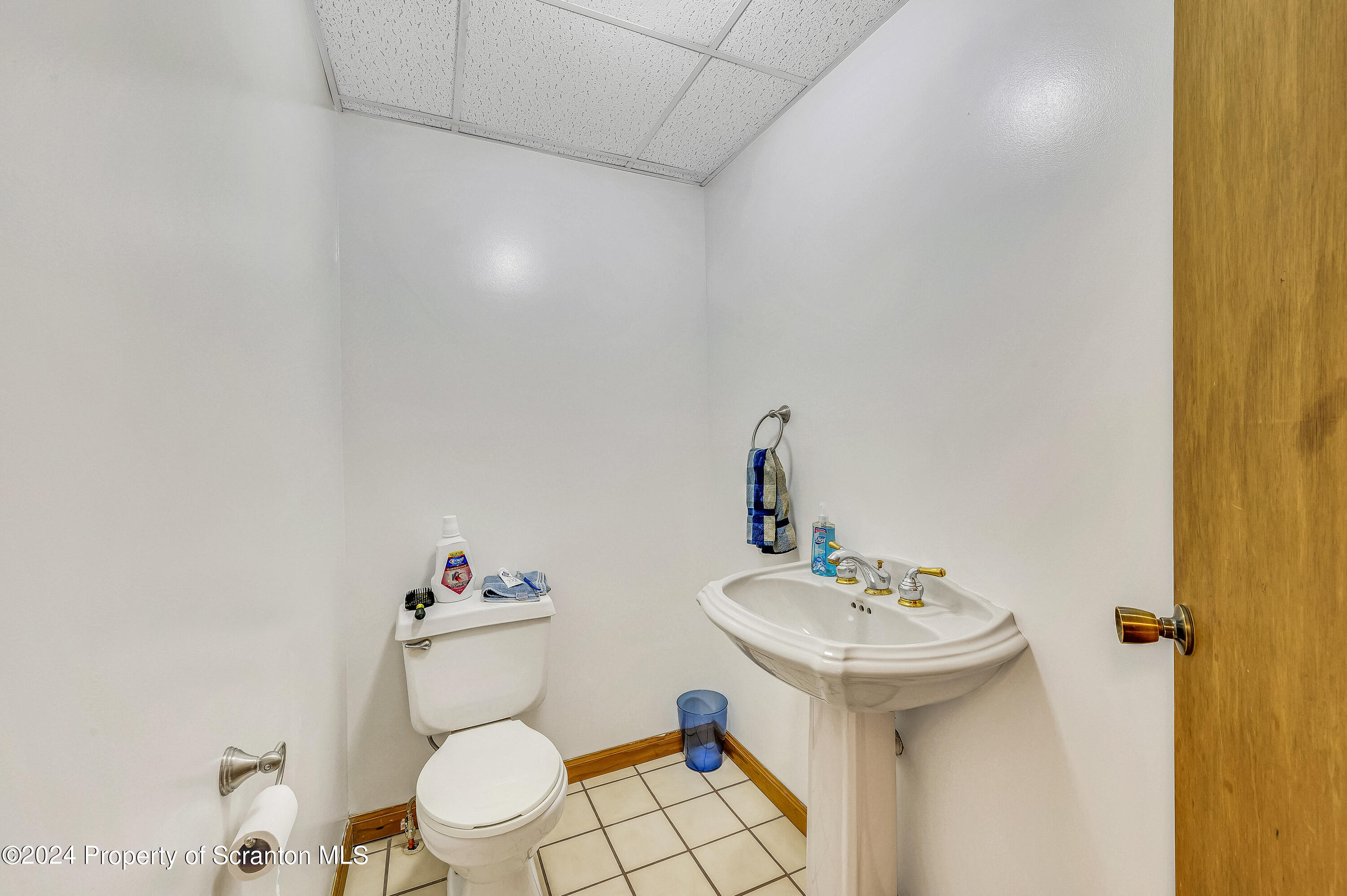 112 East Taylor Street Taylor, PA 18517 - Photo 18 of 45 a bathroom with a sink mirror and toilet