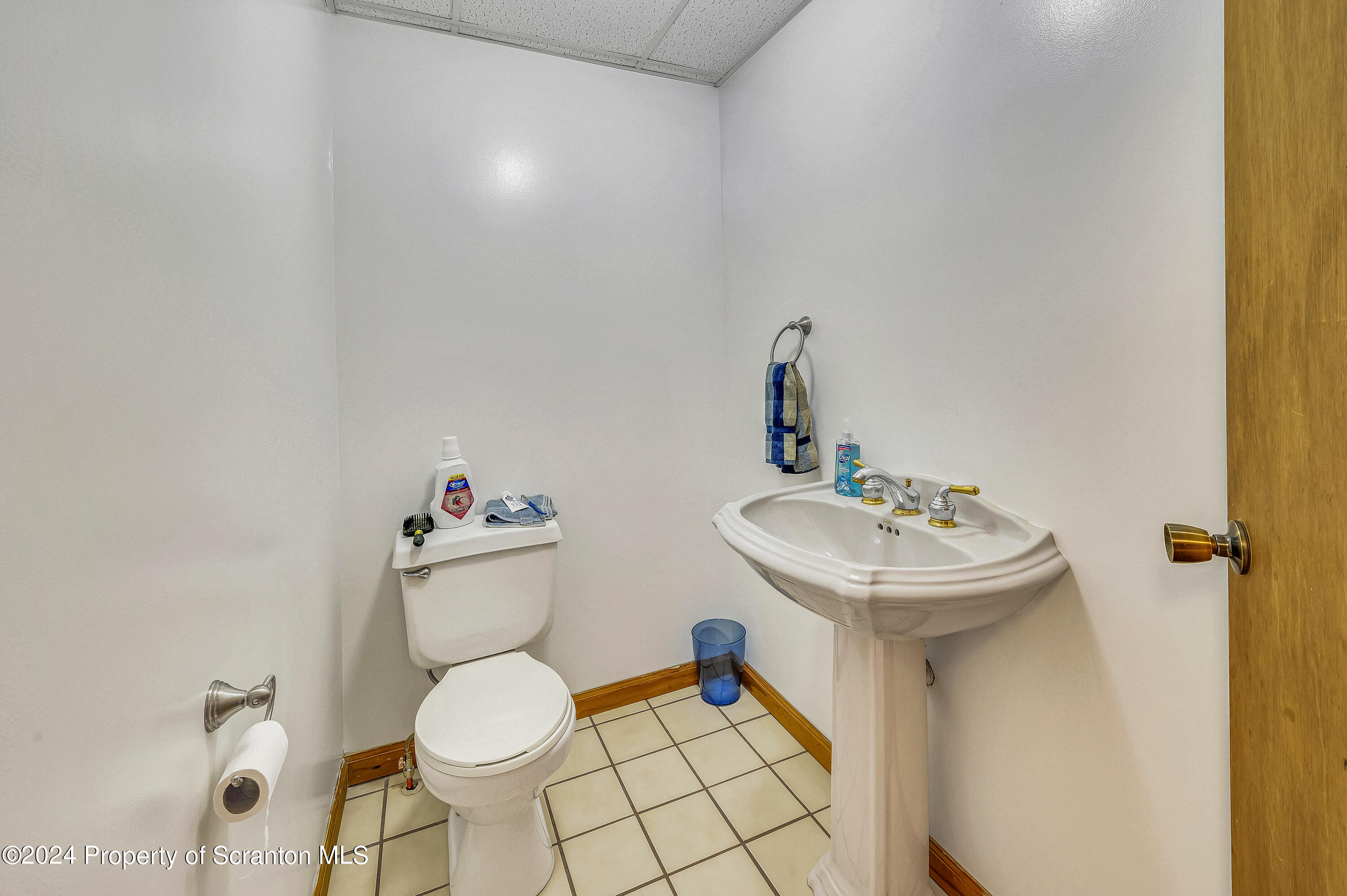 112 East Taylor Street Taylor, PA 18517 - Photo 19 of 45 a bathroom with a sink toilet and a mirror