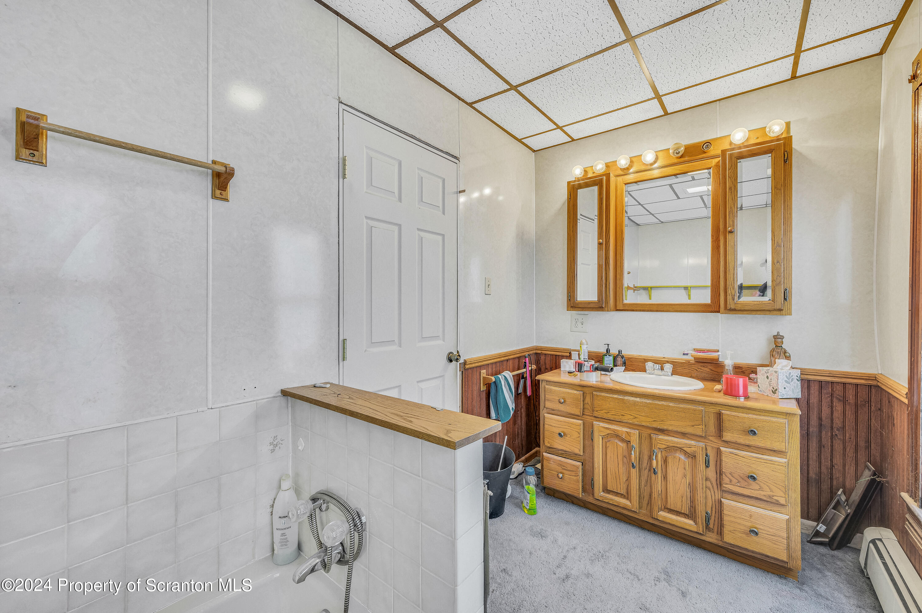 112 East Taylor Street Taylor, PA 18517 - Photo 29 of 45 a bathroom with a sink and a mirror