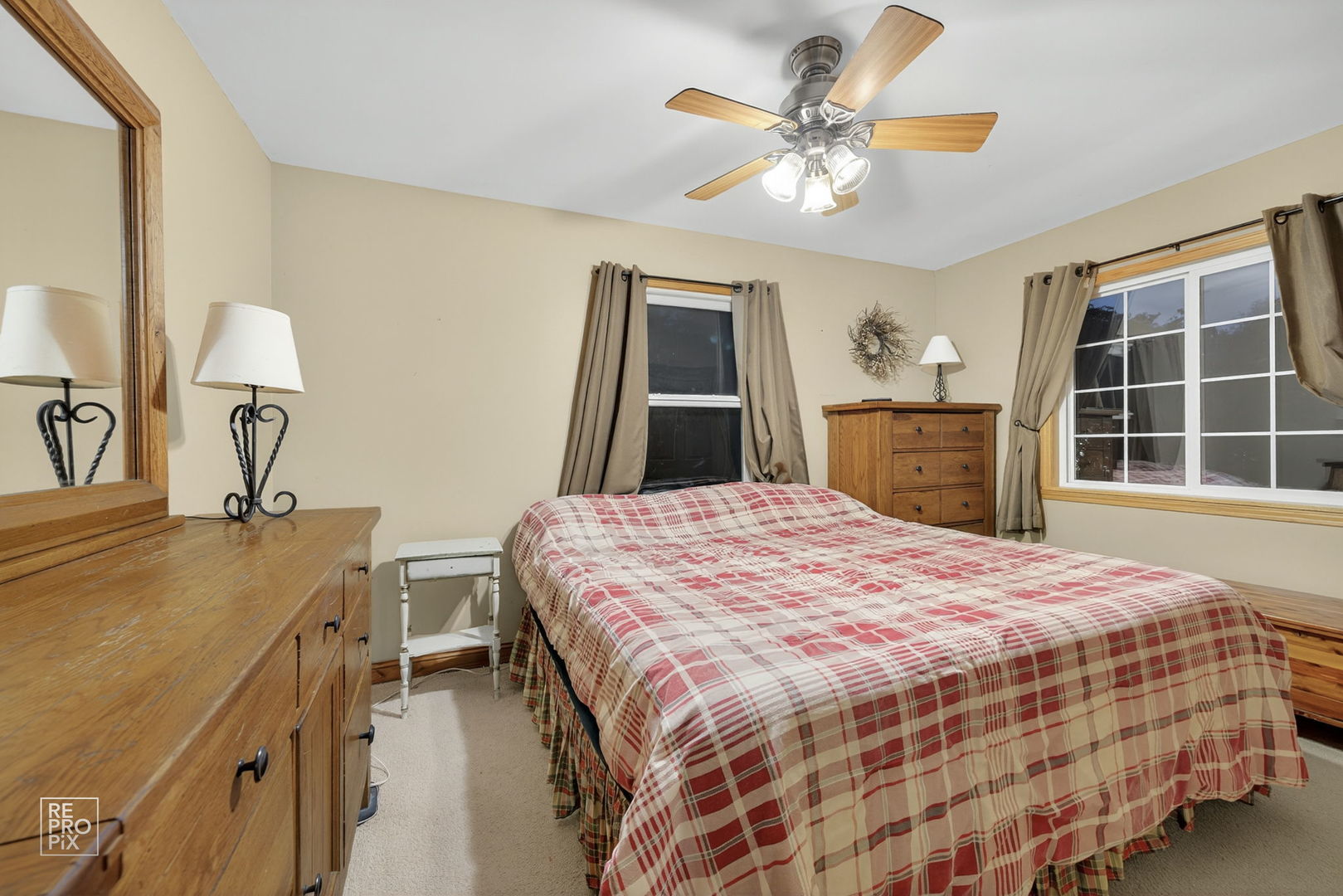 828 Carlisle Road Batavia, IL 60510 - Photo 12 of 14 a bedroom with a bed and a dresser next to a window