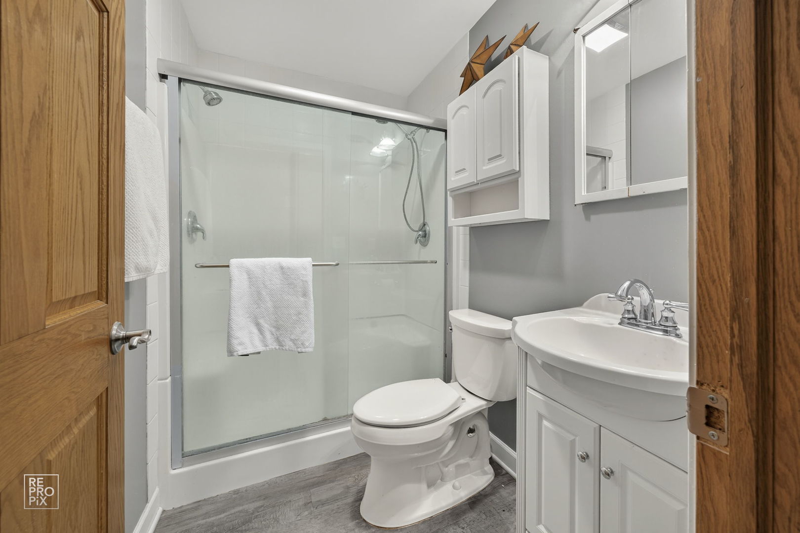 828 Carlisle Road Batavia, IL 60510 - Photo 13 of 14 a bathroom with a sink toilet and shower